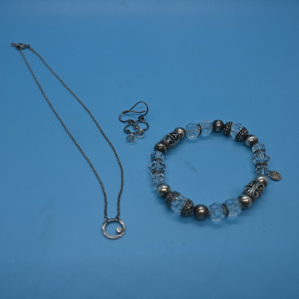 Necklace, earrings and bracelet.